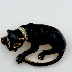 Vintage Black Panther brooch with green eyes and gold tone